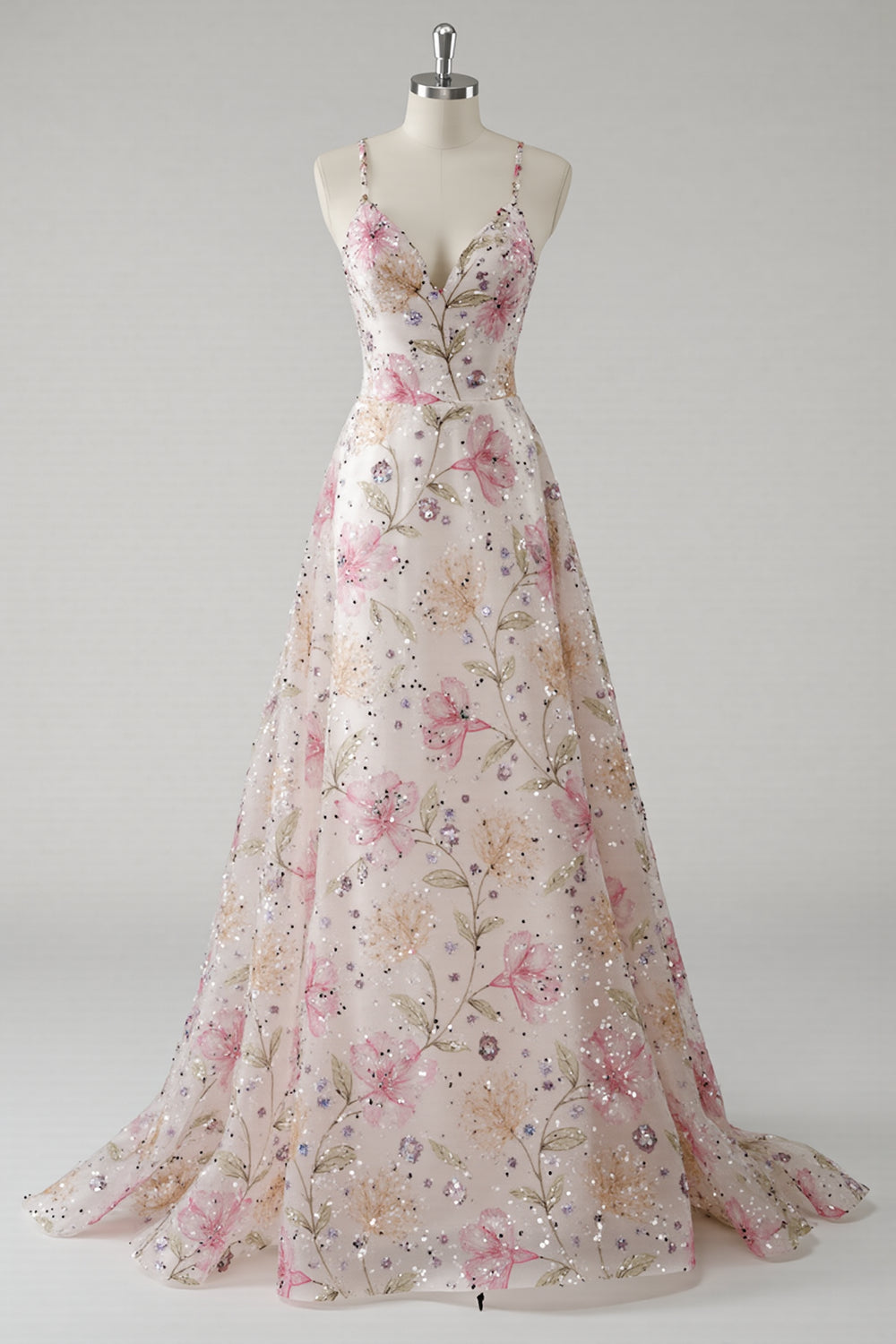 Robe de bal trapèze rose à fines bretelles, motifs floraux et paillettes