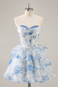 Robe mini trapèze à fleurs bleues et blanches pour bal de rentrée, bustier corset, encolure drapée et jupe à volants