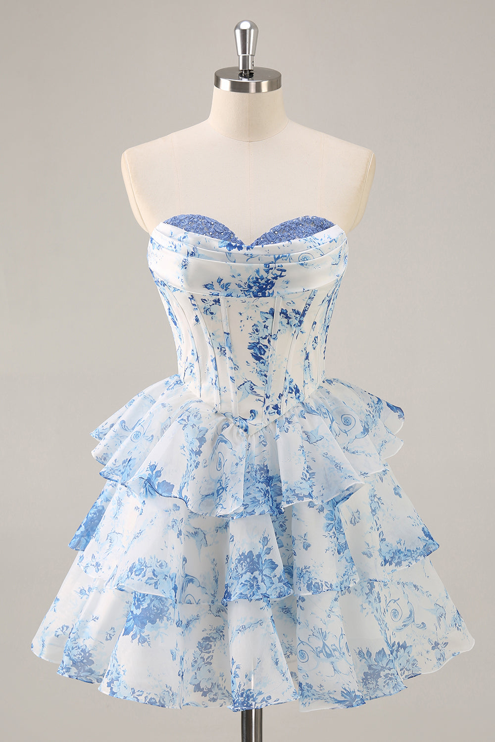 Robe mini trapèze à fleurs bleues et blanches pour bal de rentrée, bustier corset, encolure drapée et jupe à volants