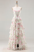 Robe de bal longue trapèze rose fleurie, décolleté cœur, corset, volants superposés et fente